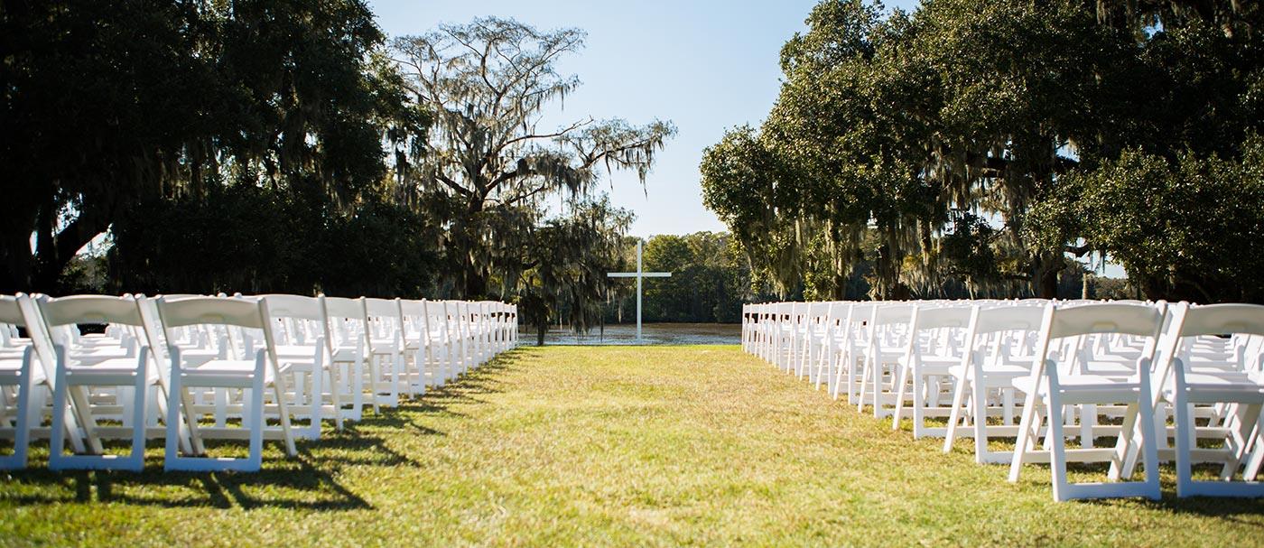 Wedding_river_white_chairs